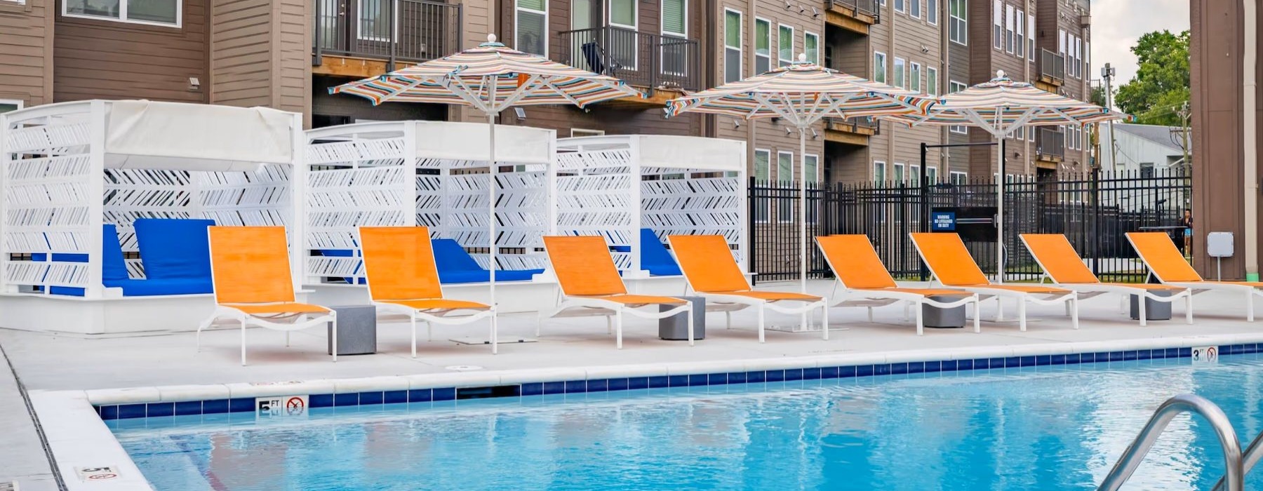 a pool with chairs around it