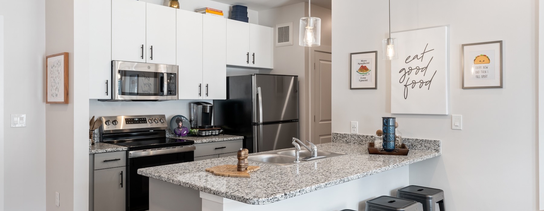 a kitchen with white cabinets