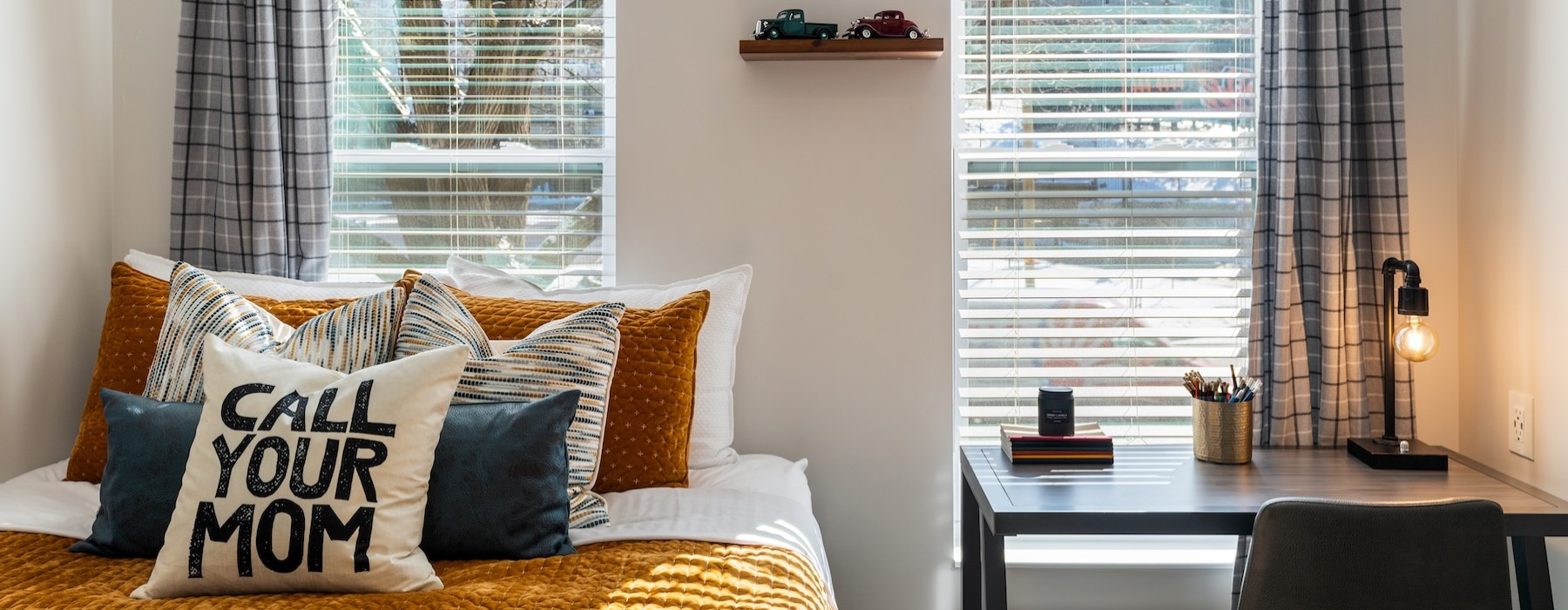 a bed with a window and curtains