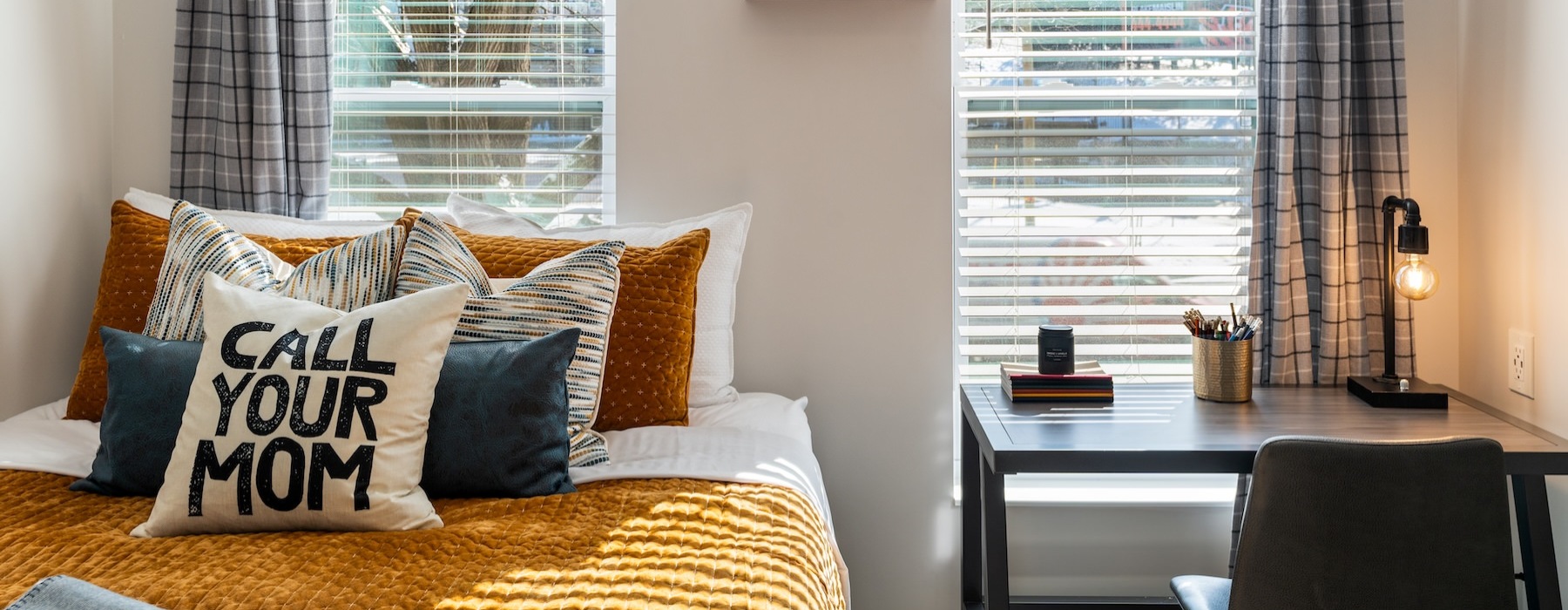 a bed with a window and curtains