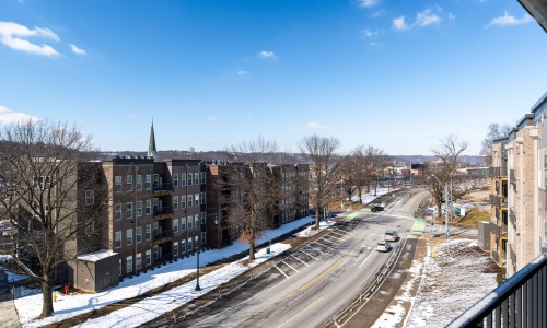 an aerial view of a street with buildings