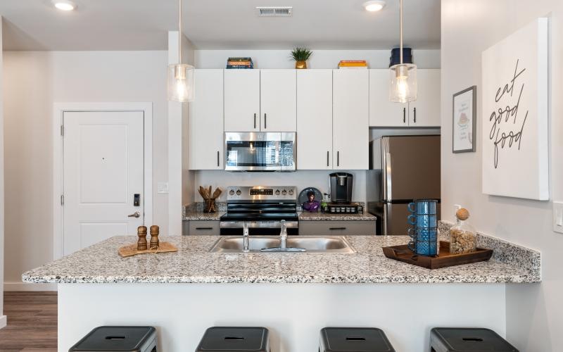 a kitchen with white cabinets